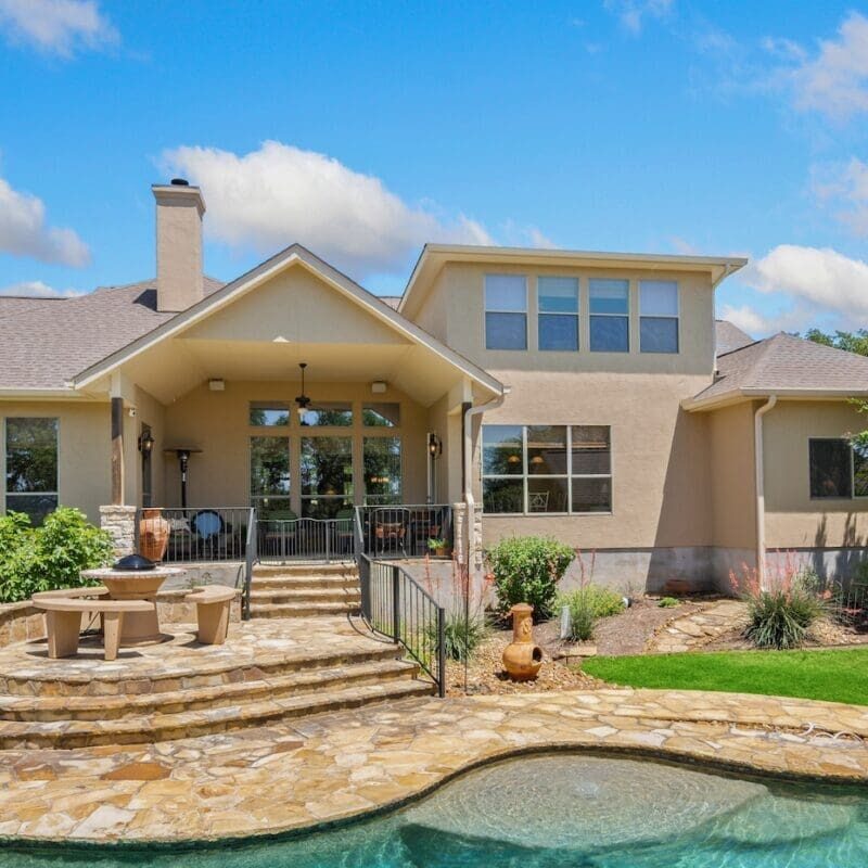 a home with a swimming pool and greenery